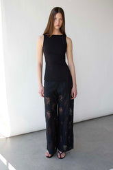 FITTED SLEEVELESS TOP WITH ASYMMETRICAL HEM